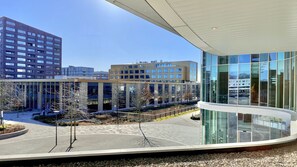 Enjoy expansive views of the urban landscape from this building's curved glass facade.