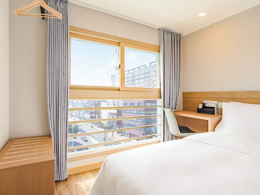 Standard Double Room, City View | Desk, laptop workspace, WiFi (free), bed sheets