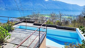 A swimming pool with a view of mountains and a lake. - Terrazzo Prato Pernice Apt.12 by Interhome (Orselina)