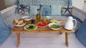 A wooden table with food items and a white pitcher on a white wooden floor. - Lux Villa LONG-TERM RENT for 7 ppl, Private pool, Sauna, Tennis, Gym, Golf, swim (Baños y Mendigo)