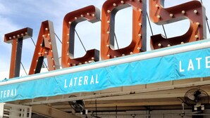 A restaurant sign with the word "TACOS" and a blue awning with "LATERAL" written on it. - Contemporary Conveniently Located 1 BR condo, Walk to beach, restaurants & bars. (San José del Cabo)
