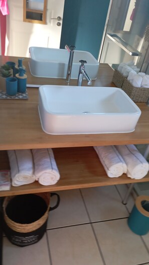 Shower, towels, soap, toilet paper