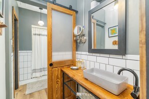 Shower, hair dryer, towels, toilet paper