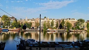 A canal with boats and buildings along the water.