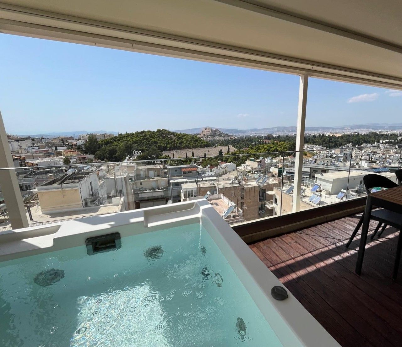 A rooftop pool with a clear view of the cityscape.