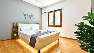 1 bedroom, desk, iron/ironing board, travel crib