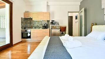 1 bedroom, desk, iron/ironing board, travel crib