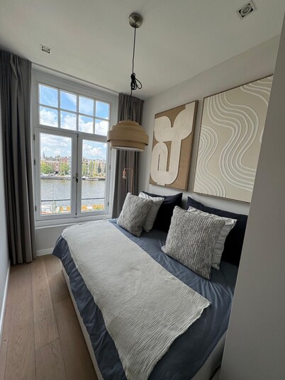 Grand Amstel Residence | Expansive Two-Story Riverfront Apartment in Central Amsterdam