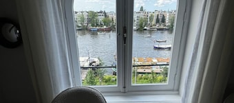 Grand Amstel Residence | Expansive Two-Story Riverfront Apartment in Central Amsterdam