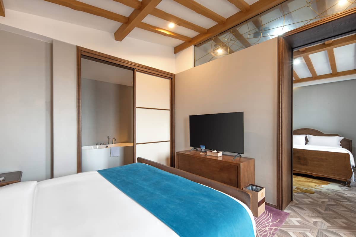 Family Suite | 2 bedrooms, down comforters, desk, blackout drapes