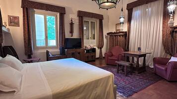 Superior Triple Room, Courtyard View | Minibar, in-room safe, desk, laptop workspace