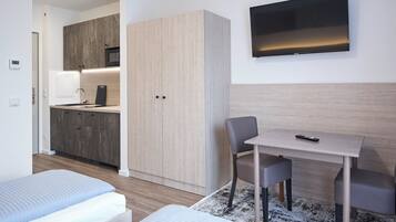 Classic Twin Room, City View | Desk, laptop workspace, blackout drapes, iron/ironing board