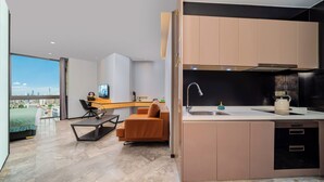 A modern apartment with a kitchen, a dining area, and a living room. - Weekend International Apartment- Beijing Rd A-mall (Guangzhou)