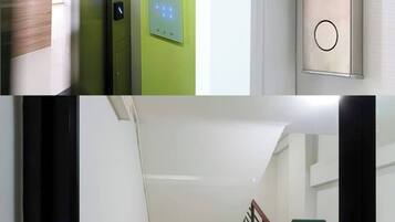 A modern elevator with a green control panel, a hand pressing a button, and a staircase with a sign indicating 'EXIT'.