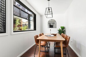 Enjoy meals in this stylish dining area with a wooden table and six leather chairs.