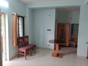 Deluxe Triple Room, Balcony, City View | Living area - Sri Vinayaka Lodge (Somvarpet)