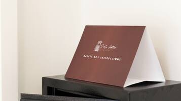 A safe deposit box with a keypad and a card inserted.