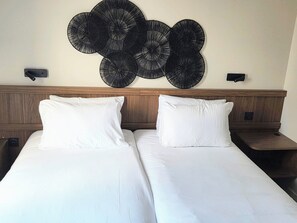 Premium bedding, pillowtop beds, desk, laptop workspace