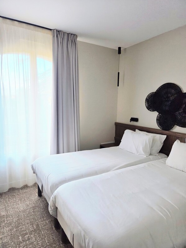 Premium bedding, pillowtop beds, desk, laptop workspace