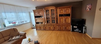 The modern vacation apartment is situated in a quiet location next to the local recreation area