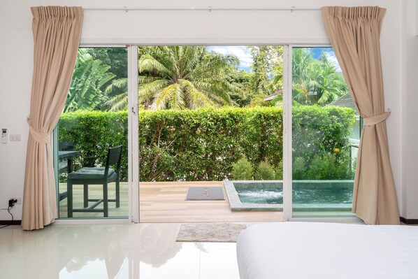 Deluxe bungalow, uitzicht op tuin | Uitzicht vanuit de kamer