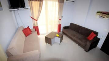 Superior Apartment, Balcony, Sea View | Living area | Flat-screen TV