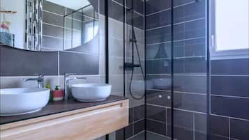 Shower, hair dryer, towels, toilet paper