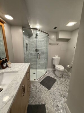 Shower, hair dryer, towels, soap