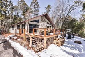 Escape to a serene forest retreat with a cabin-style hotel featuring a cozy outdoor space and a natural setting.