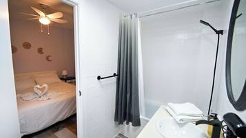 Shower, hair dryer, towels, soap