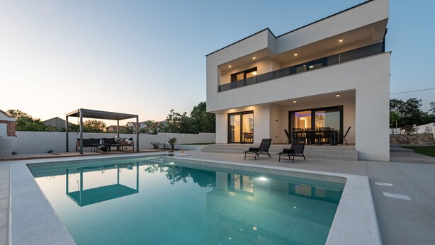 A modern two-story house with a swimming pool, outdoor seating, and a covered patio. - Villa Roma Murvica Zadarvillas (Policnik)