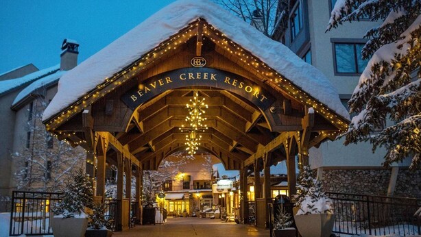 A wooden lodge entrance with a sign reading "Beaver Creek Resort." - Luxe 4 Bedroom Beaver Creek Lodge Condo With ski in, ski out Access (Avon)