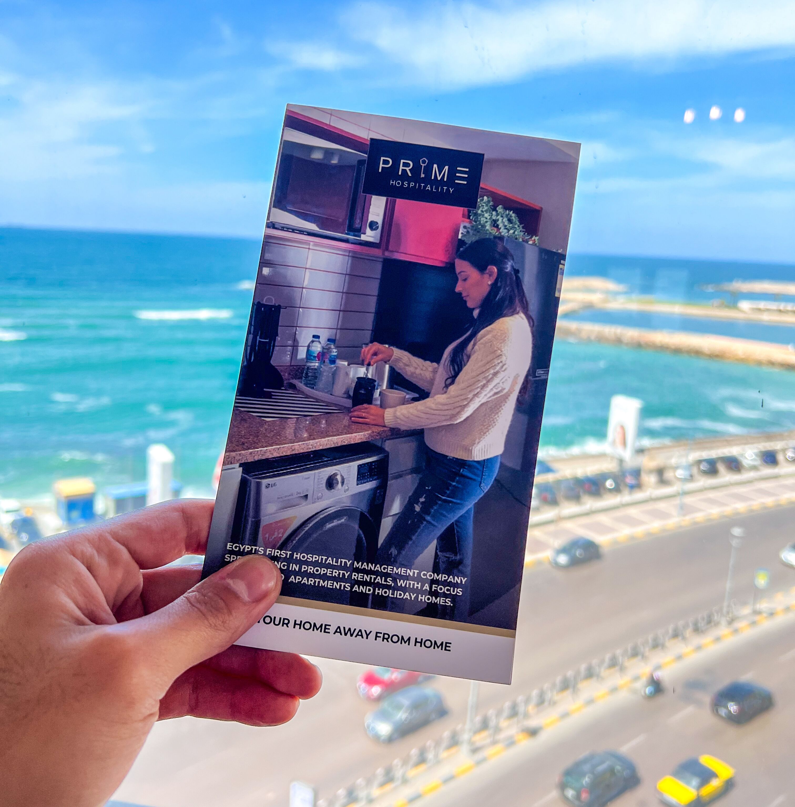 A brochure for PRIME Hospitality, highlighting a kitchen area with modern appliances and a view of the ocean.