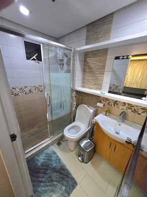 Hair dryer, bidet, towels, soap