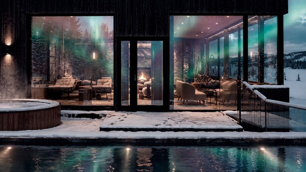 A modern building with large glass windows, a hot tub, and a pool. - SkyView Igloo Resort & Spa (Rovaniemi)