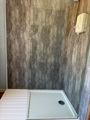 Shower, eco-friendly toiletries, hair dryer, towels