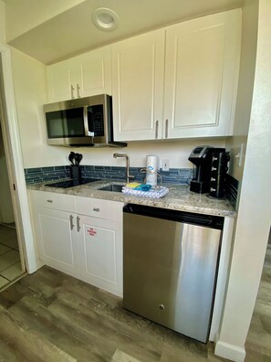 Fridge, microwave, stovetop, coffee/tea maker