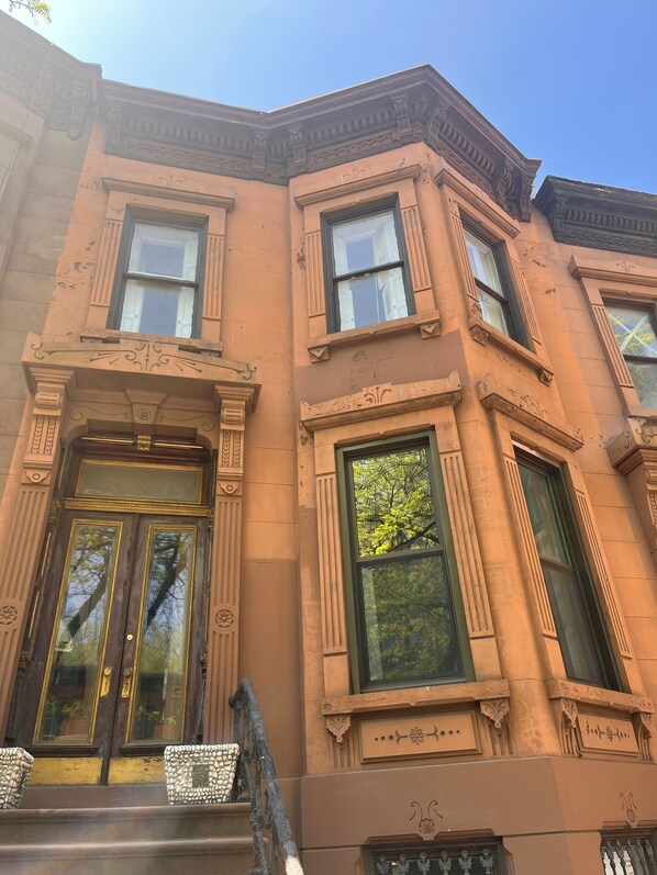 Classic architecture with a historic charm, featuring a prominent entrance and decorative elements.