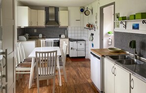 Fridge, stovetop, dishwasher, coffee/tea maker