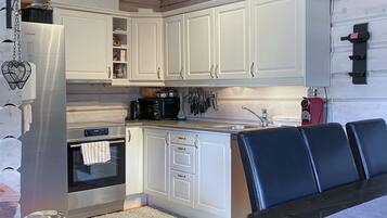 Fridge, stovetop, dishwasher, coffee/tea maker