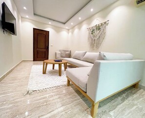 Appartement, 1 kingsize bed, uitzicht op tuin | Woonruimte