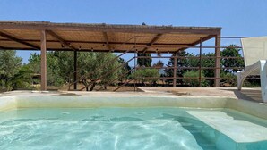 A swimming pool with a wooden deck and a pergola structure. - Nice home in Son Servera (Son Servera)