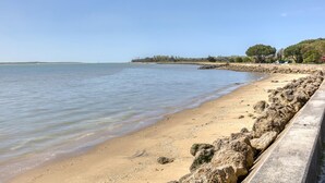 A sandy beach with a rocky breakwater and calm water. - Awesome home in Saint-Trojan-les-Bains (Saint-Trojan-les-Bains)
