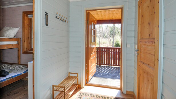 A room with a bunk bed, a wooden bench, and a door leading to a balcony. - 2 bEdroom gorgeous home in Ed (Ed)