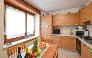 Fridge, stovetop, dishwasher, coffee/tea maker