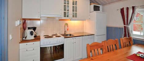 Fridge, stovetop, dishwasher, coffee/tea maker