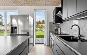 Fridge, stovetop, dishwasher, coffee/tea maker