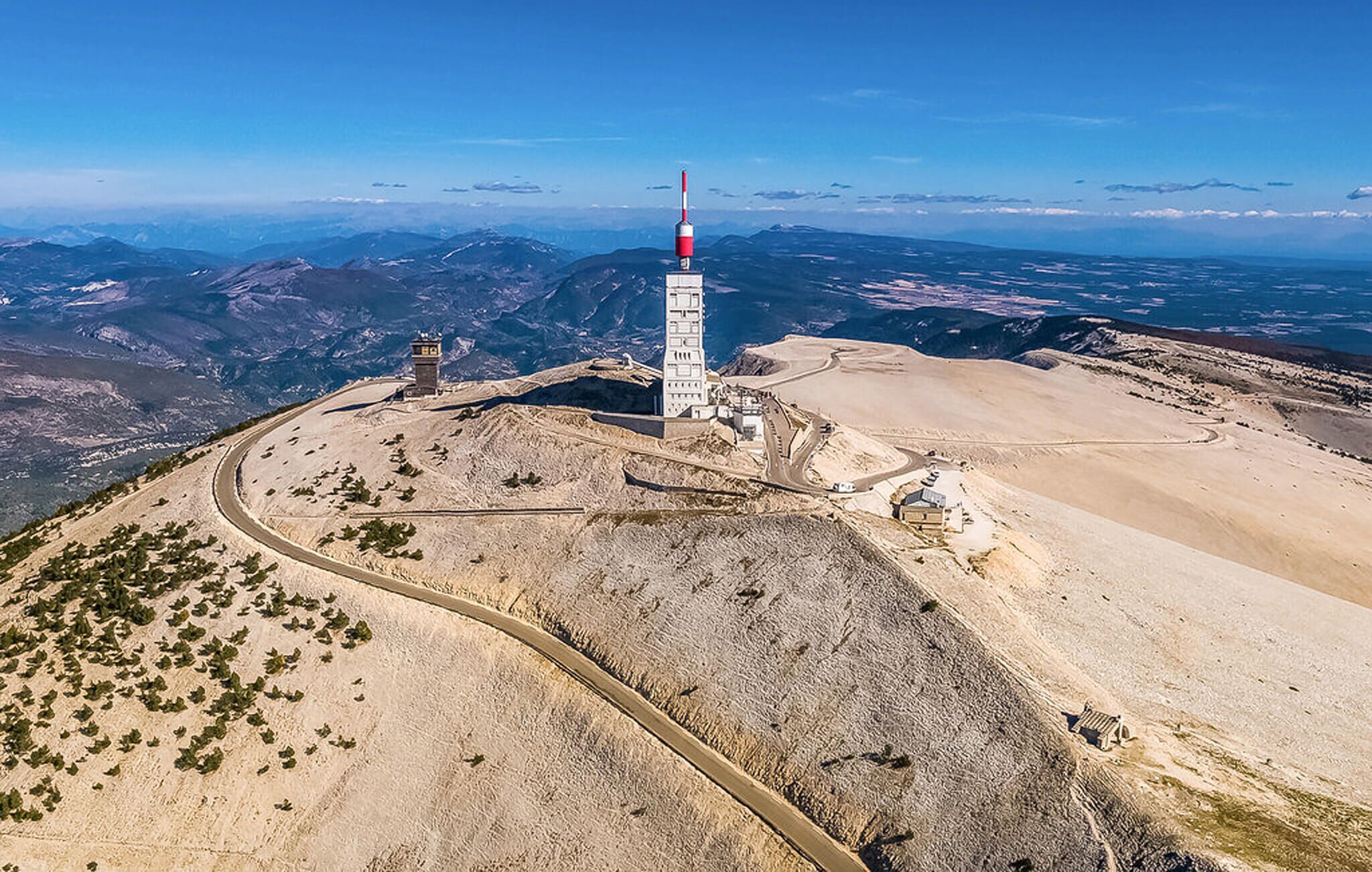 A high-altitude observation tower with a clear view of surrounding mountains and valleys.