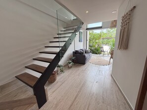 Deluxe Apartment, Pool View | Living area | 50-inch Smart TV with digital channels