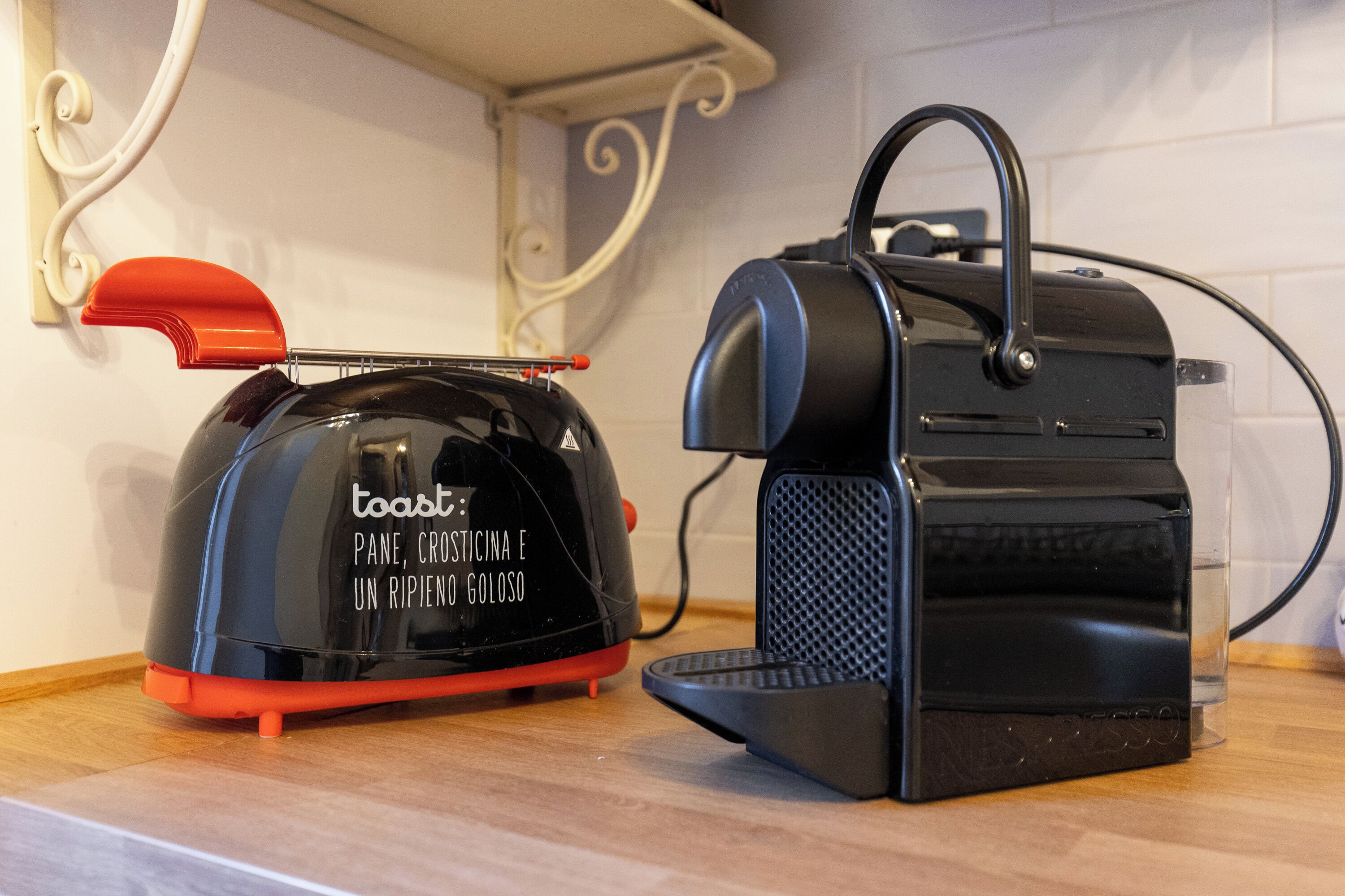 A toaster and a bread maker on a kitchen counter.